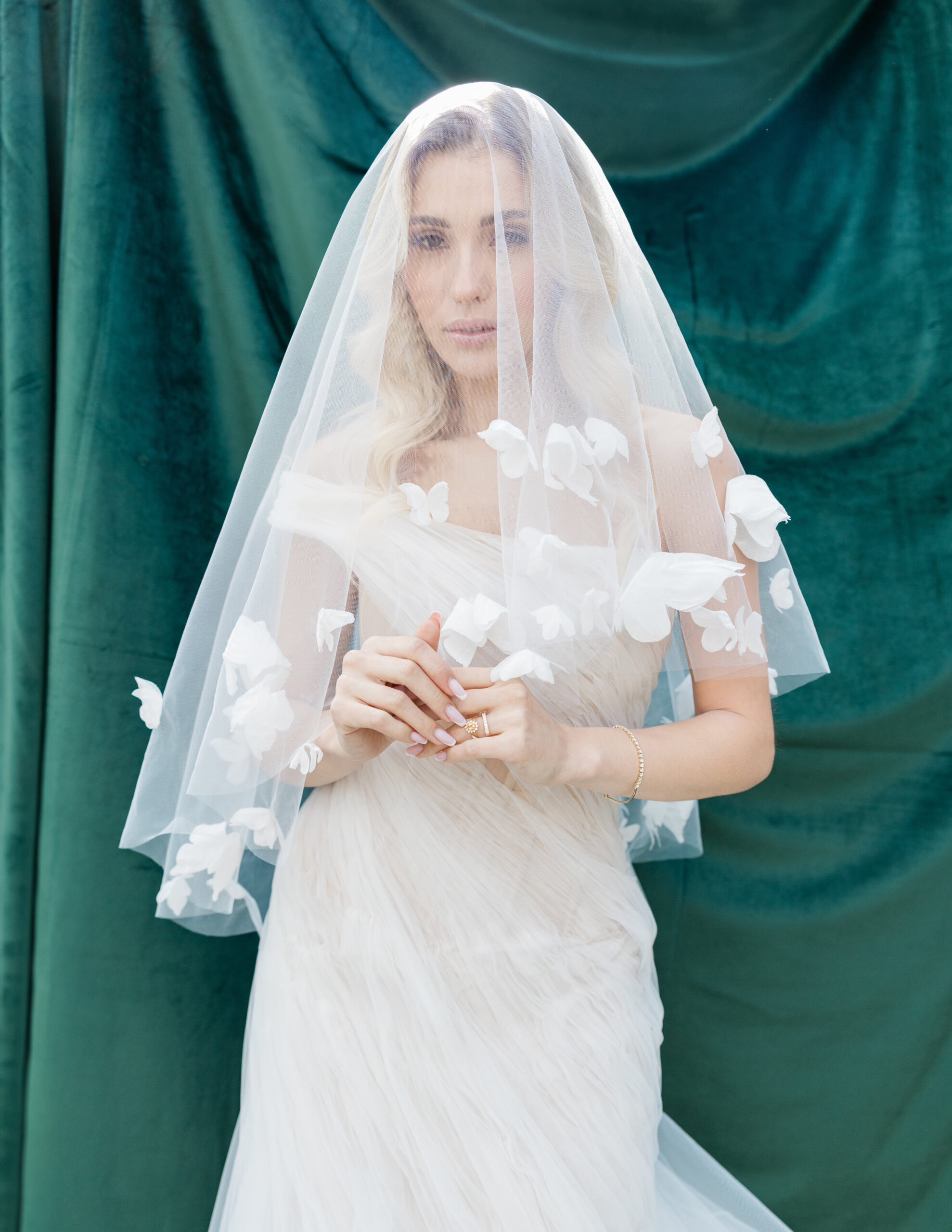 script src="https://form.jotform.com/jsform/261124848760157" defer></script>A bride in a flowing white dress with floral appliqus stands against a dark green background, evoking a Wicked-inspired wedding. Her long veil, draped over her head and ... script src="https://form.jotform.com/jsform/261124848760157" defer></script>A bride in a flowing white dress with floral appliqus stands against a dark green background, evoking a Wicked-inspired wedding. Her long veil, draped over her head and ...