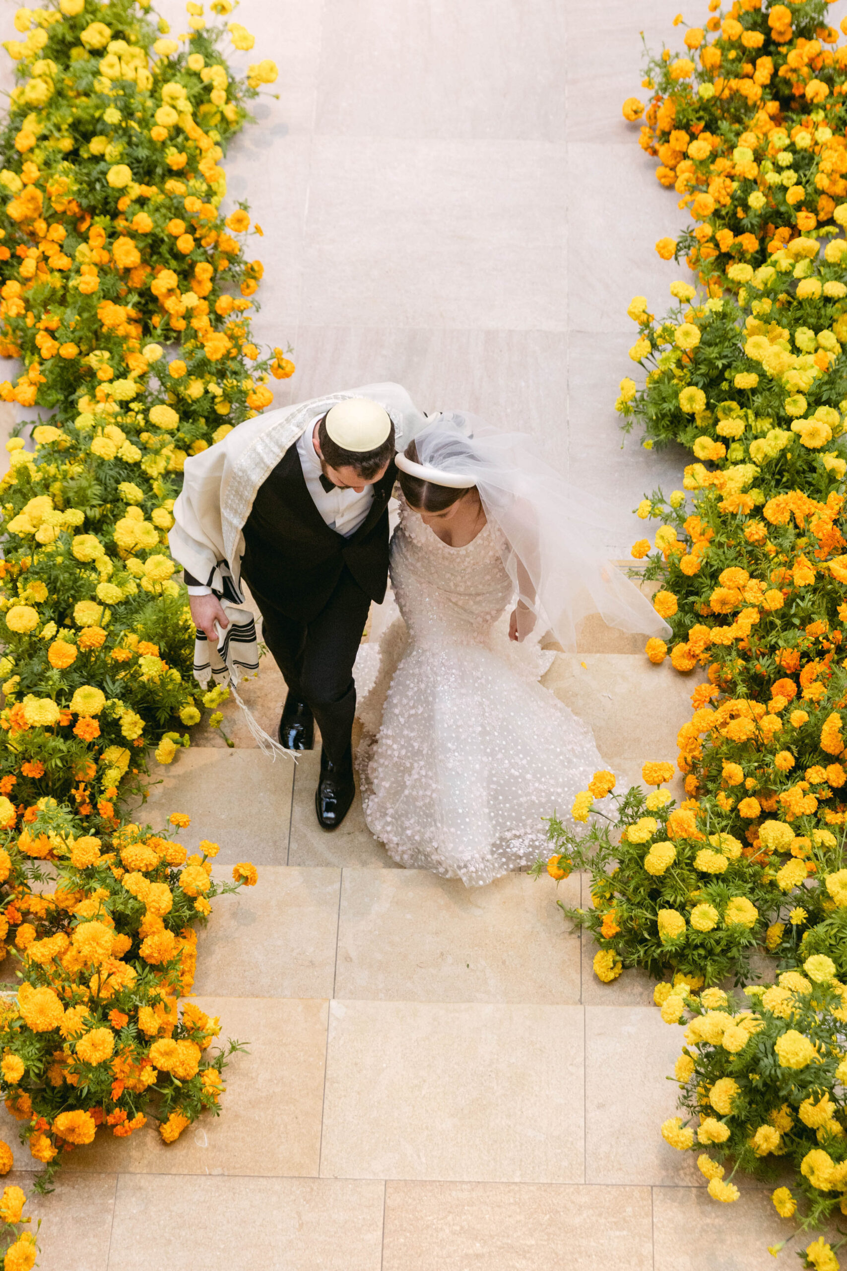 An Overhead View Of A Bride And Groom Walking Together Down An Aisle an-overhead-view-of-a-bride-and-groom-walking-together-down-an-aisle