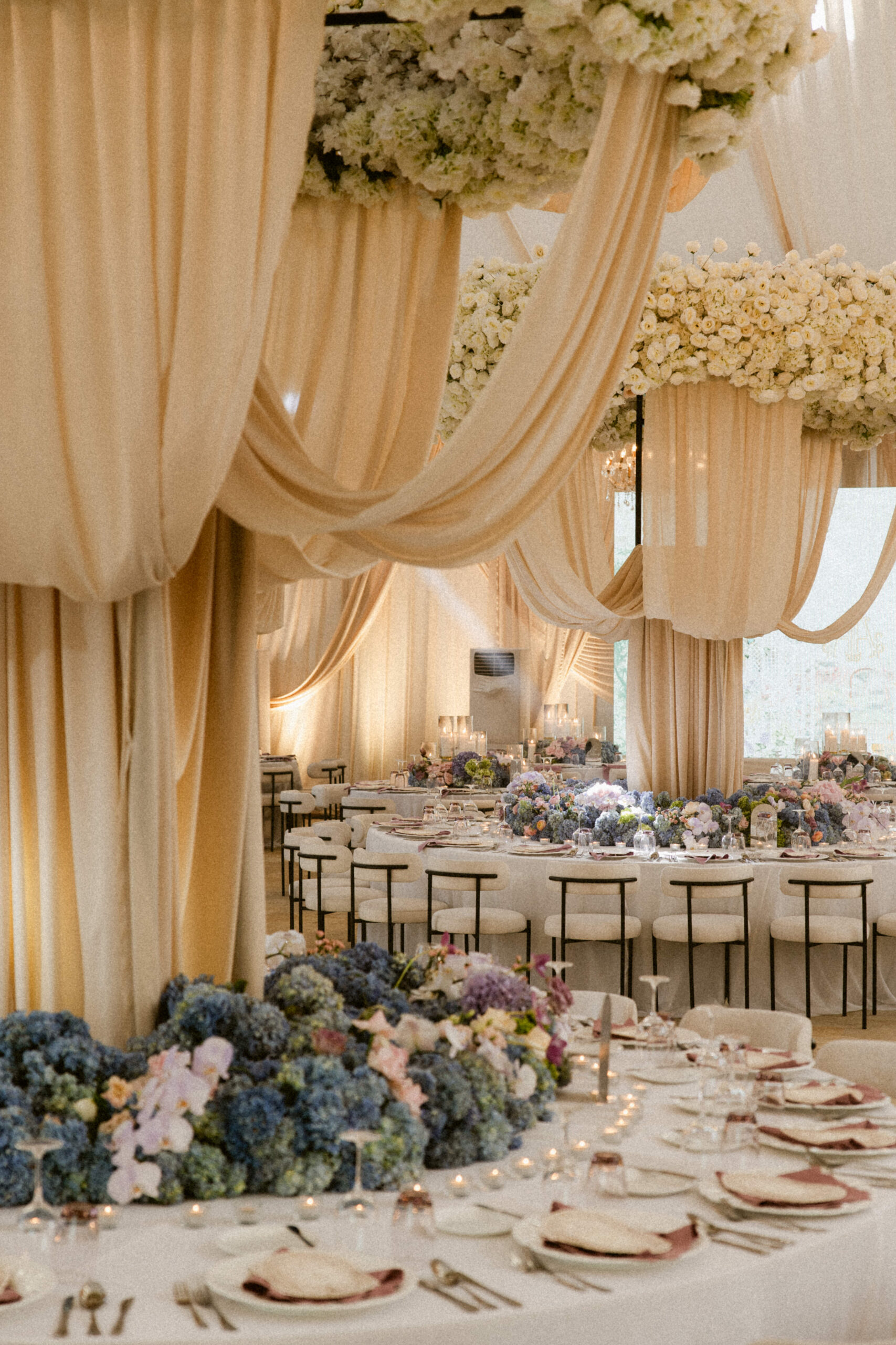 Elegant Glasshouse wedding reception with draped cream fabric ceilings ...