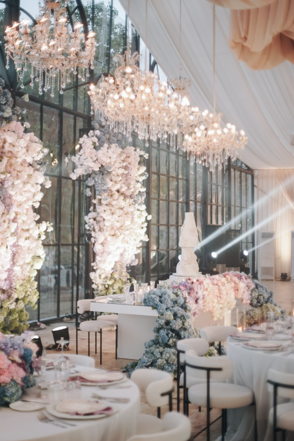 Elegant Glasshouse wedding reception hall with large windows, pastel ...