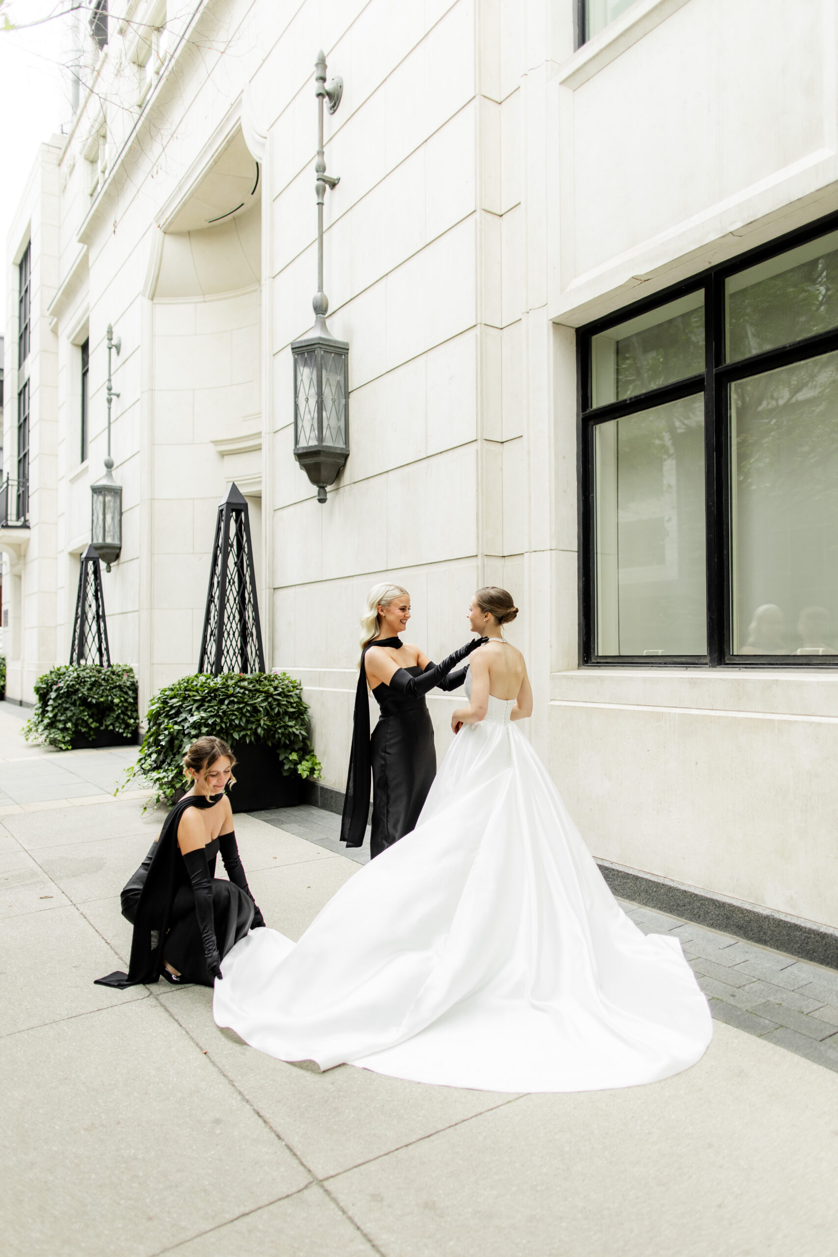 black dresses toronto A bride in a white gown stands outside Windsor Arms in Toronto, while two women in A perfect choice for Ruffle Dress Marina Ruffle Shoulder Midi Size:US30+