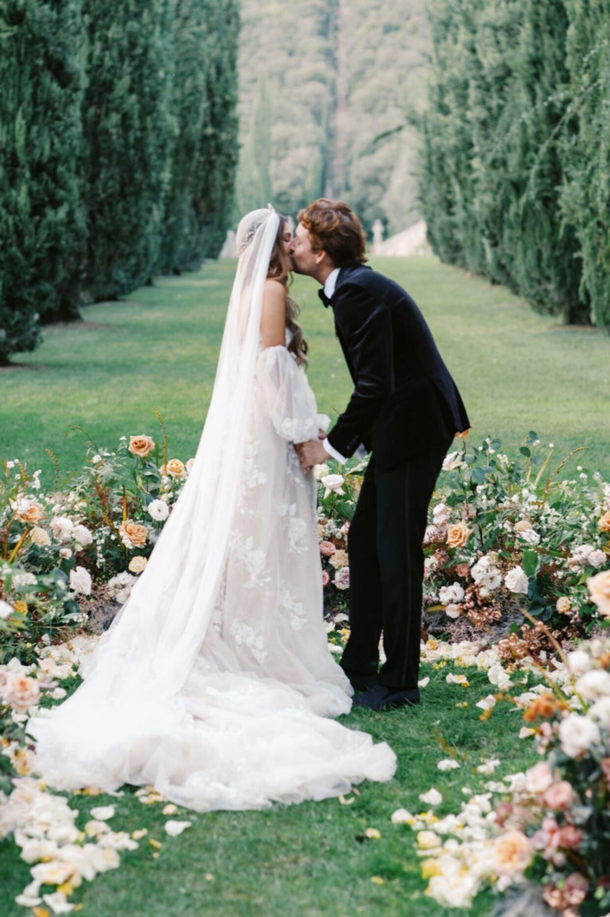 A wedding ceremony setup creates a pink rose wonderland, featuring 