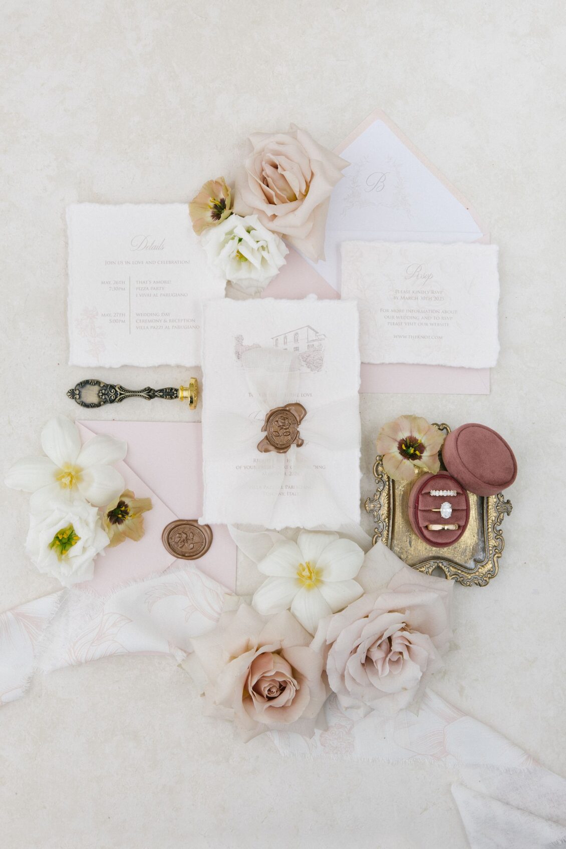 Blush handmade wedding stationery with wax seals and flowers