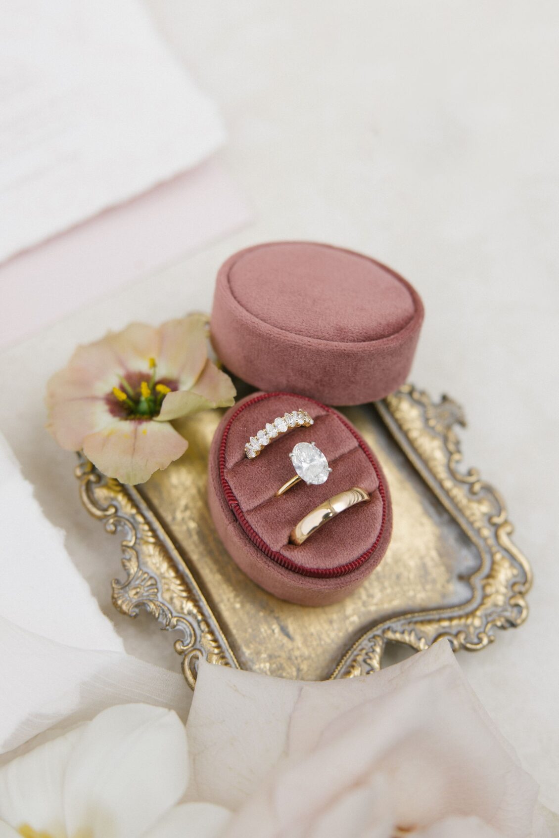 Diamond engagement ring and wedding bands in a rose velvet box