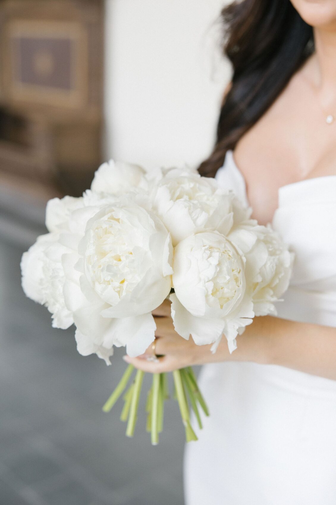 White peony bridal bouquet with Jennifer in her wedding gown