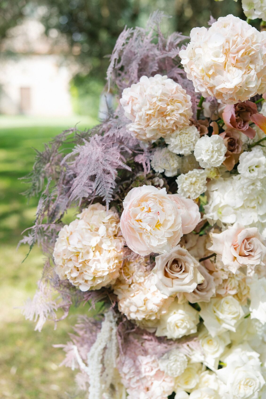 Peonies, roses, hydrangea, and amaranthus in the ceremony flowers