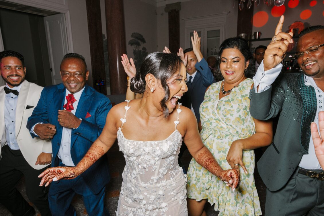 Brittney and Zeus celebrating on the dance floor at Château Martinay