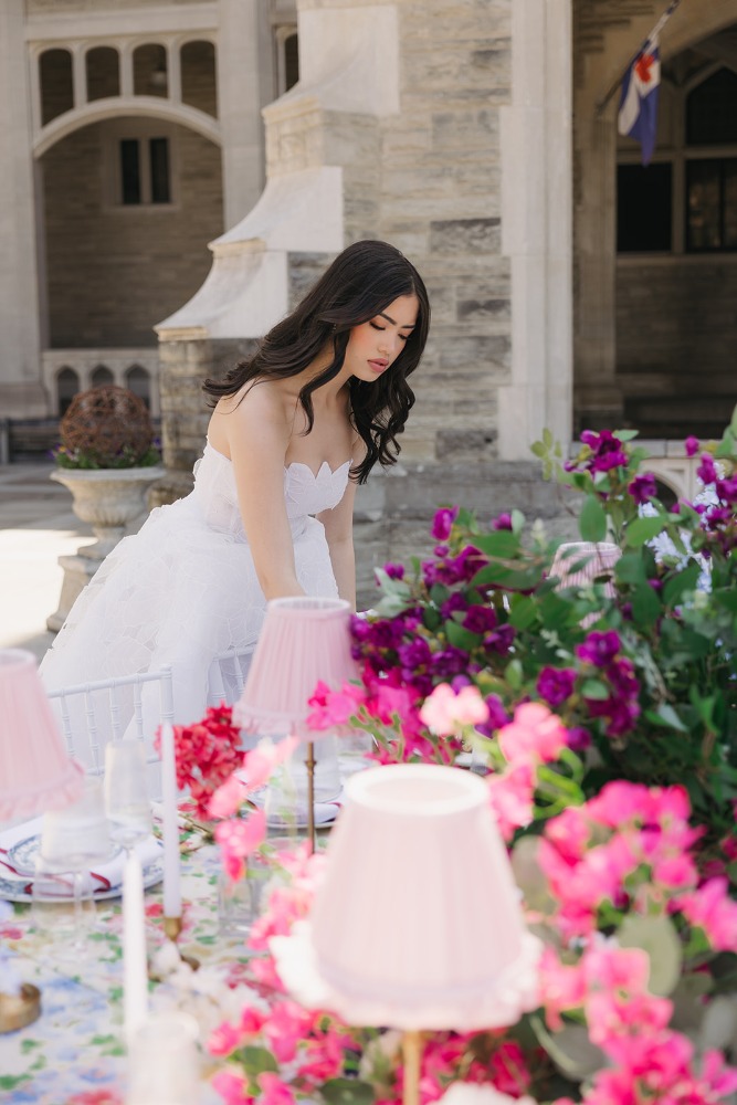 Intimate bridal portrait beside the flower-filled table