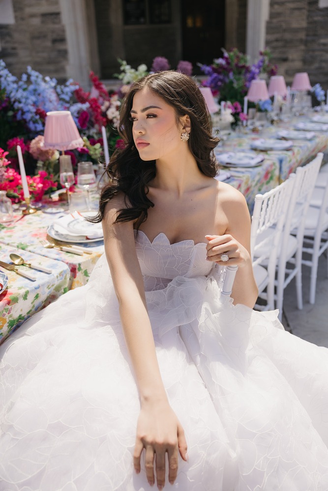 Bridal fashion portrait beside the reception flowers