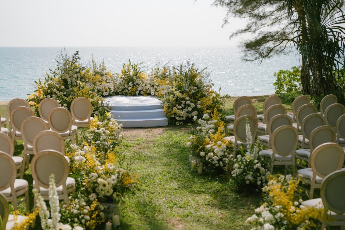 Christine and Shaun's Phuket wedding, symmetrical oceanfront aisle overview is the ceremony-design establishing image.