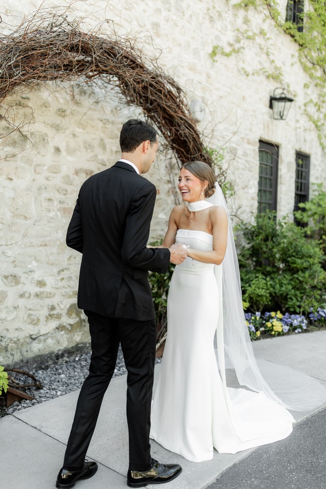 Marta and Eric at Elora Mill — first look reaction — photographed by Rose Vine Studios