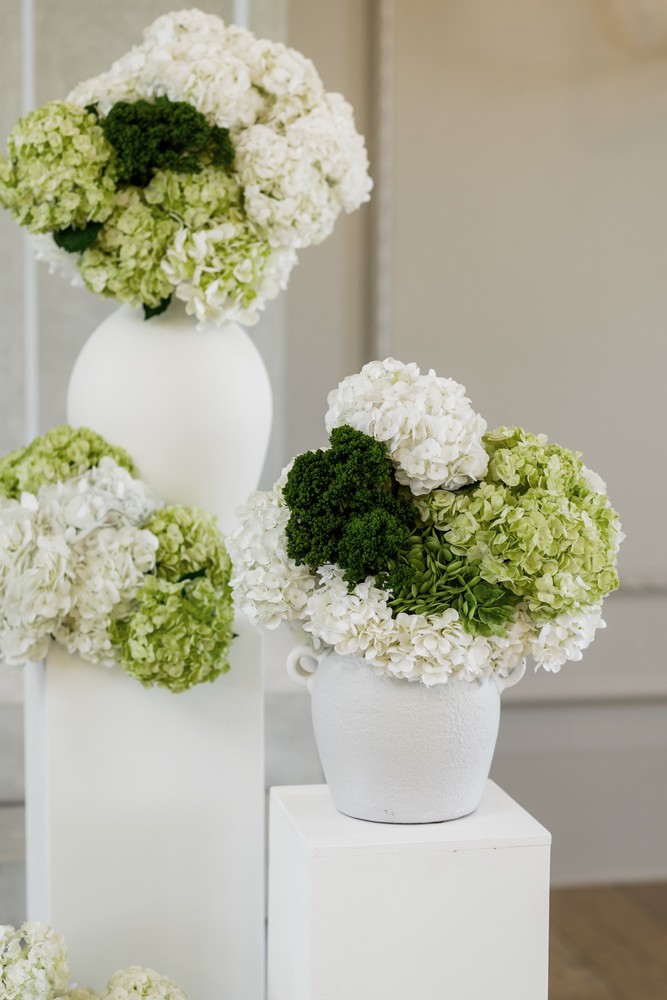 Marta and Eric at Elora Mill — white green floral installation — photographed by Rose Vine Studios