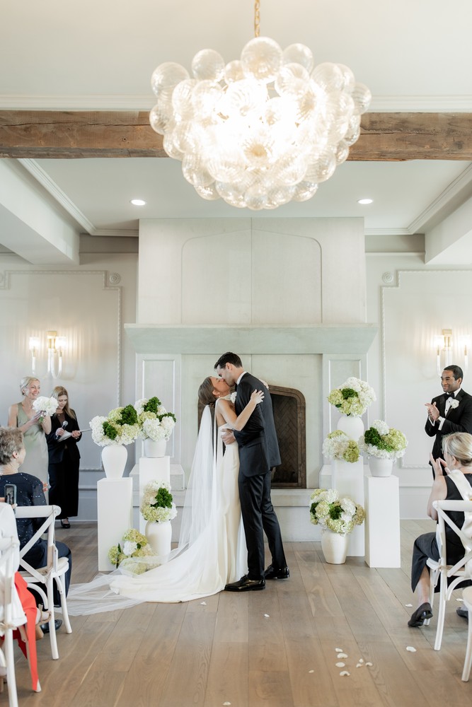 Marta and Eric at Elora Mill — couple ceremony kiss — photographed by Rose Vine Studios
