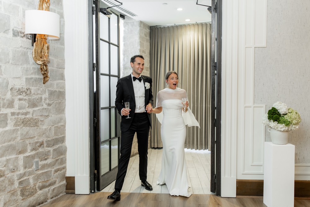 Marta and Eric at Elora Mill — couple reception entrance — photographed by Rose Vine Studios