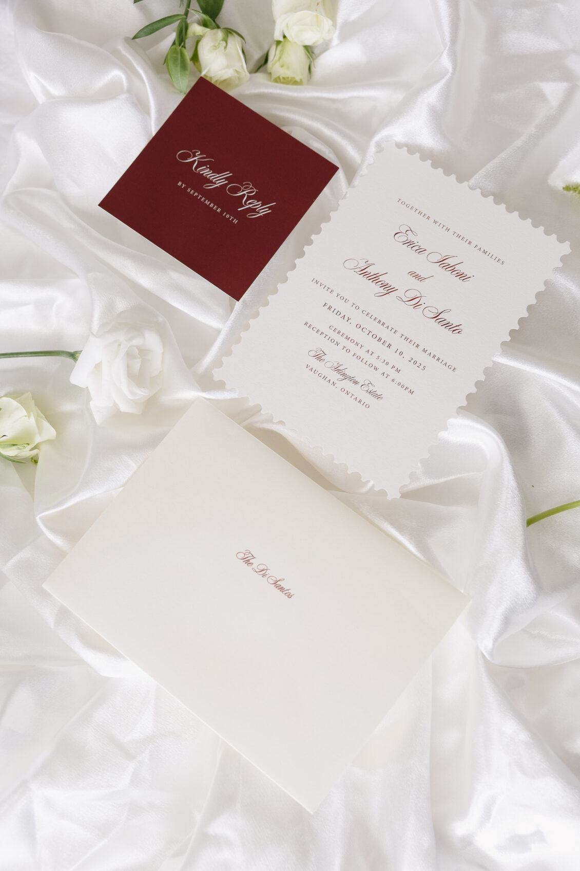 Black-and-white wedding stationery arranged with ribbon.