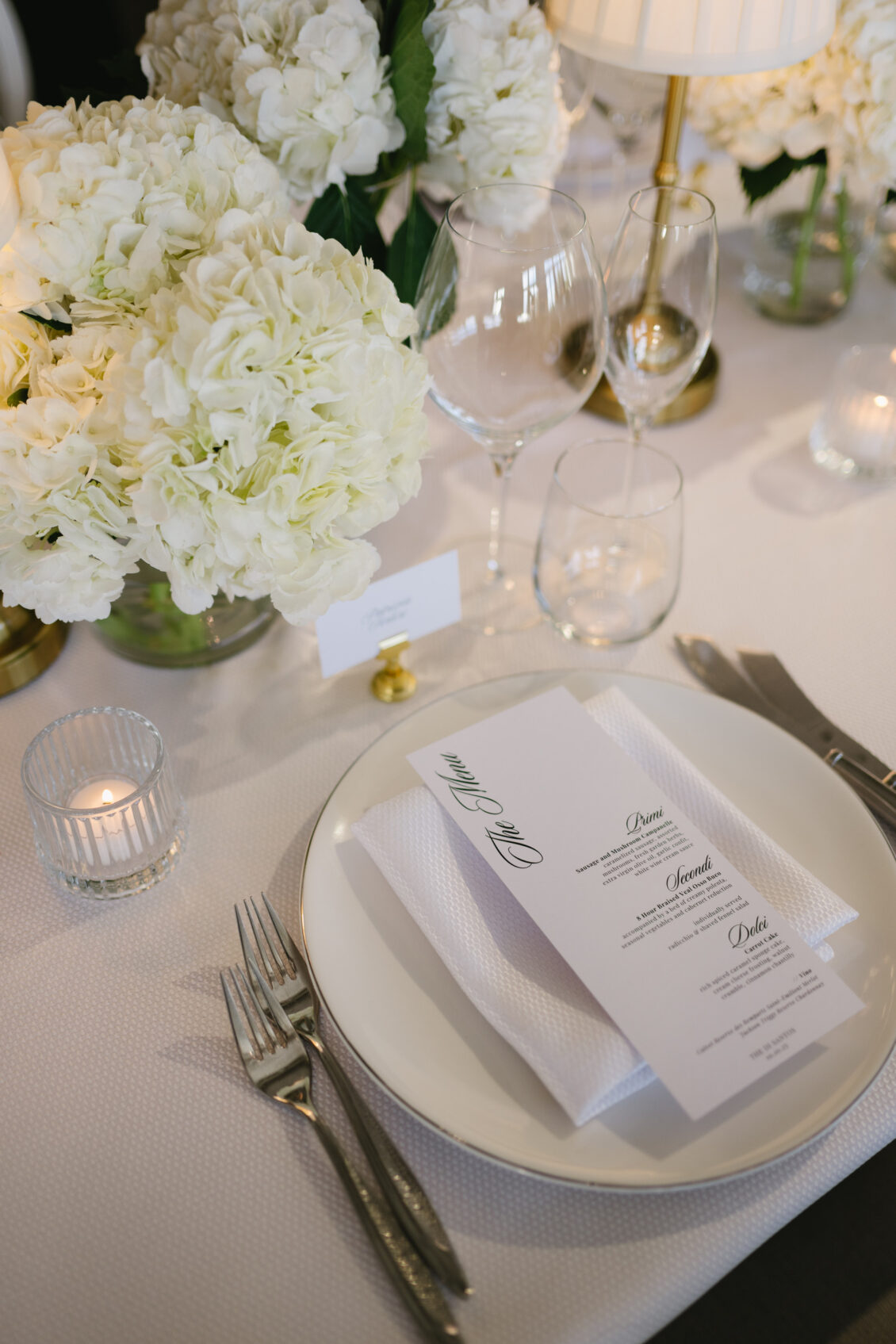 A black-and-white reception place setting with bread plate.