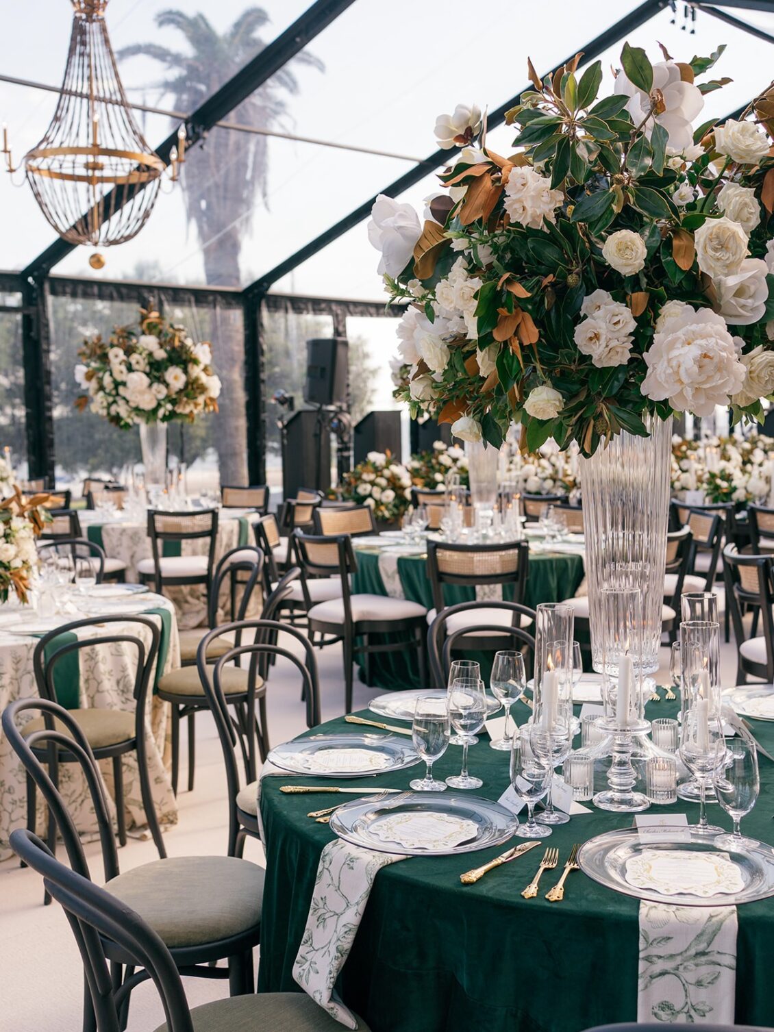 Magnolia florals, checkerboard details, and reception design at White House Biloxi.