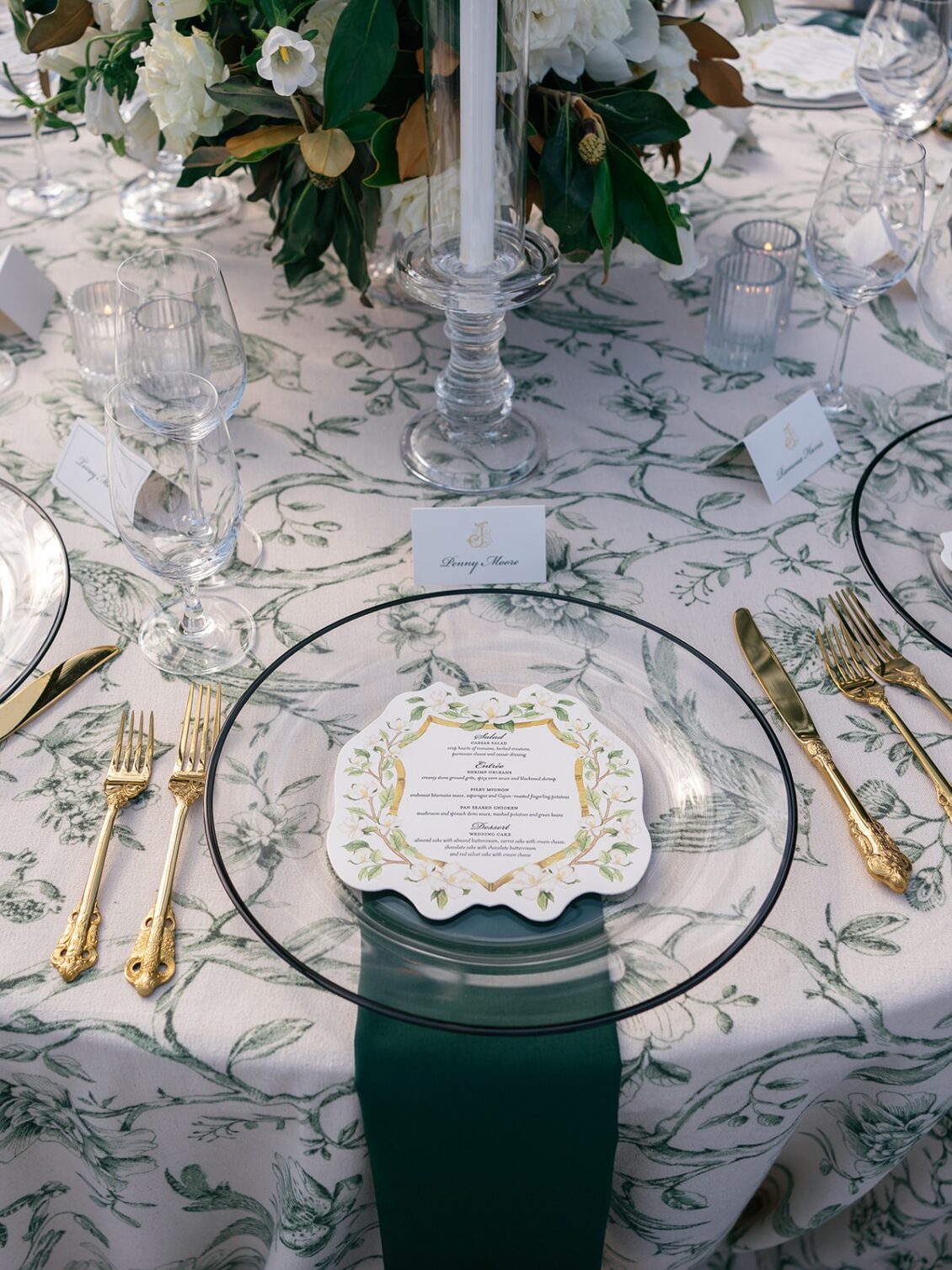 Magnolia florals, checkerboard details, and reception design at White House Biloxi.