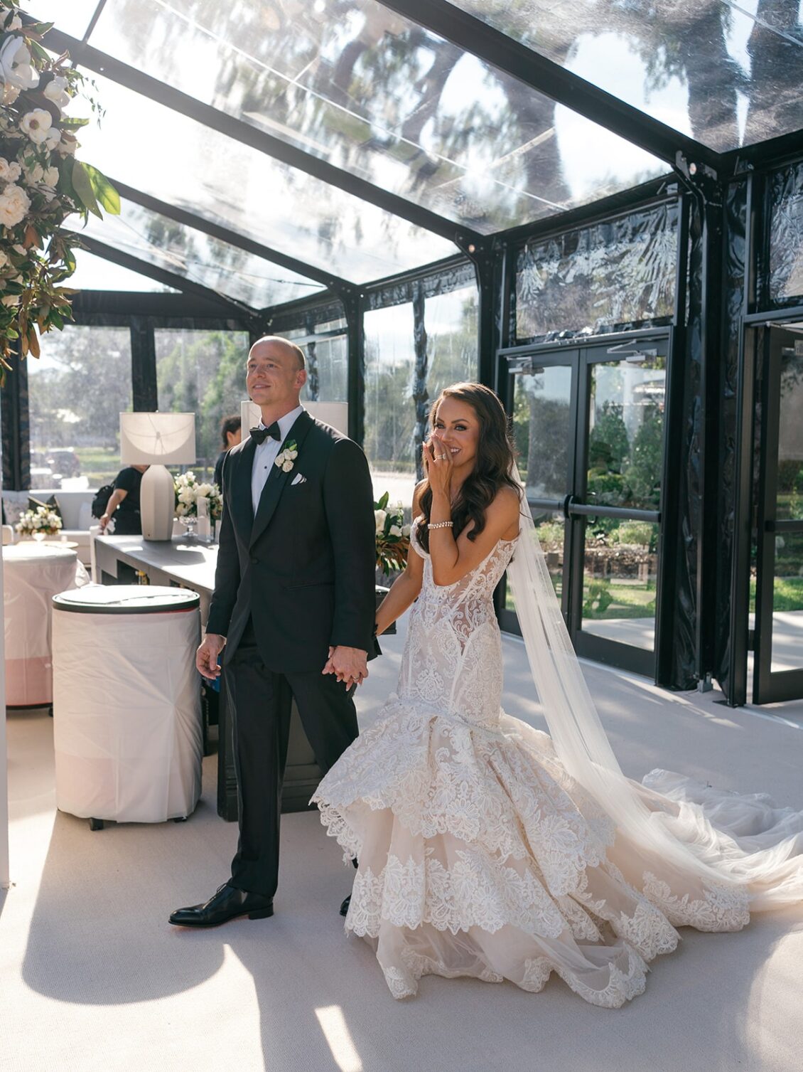 Magnolia florals, checkerboard details, and reception design at White House Biloxi.