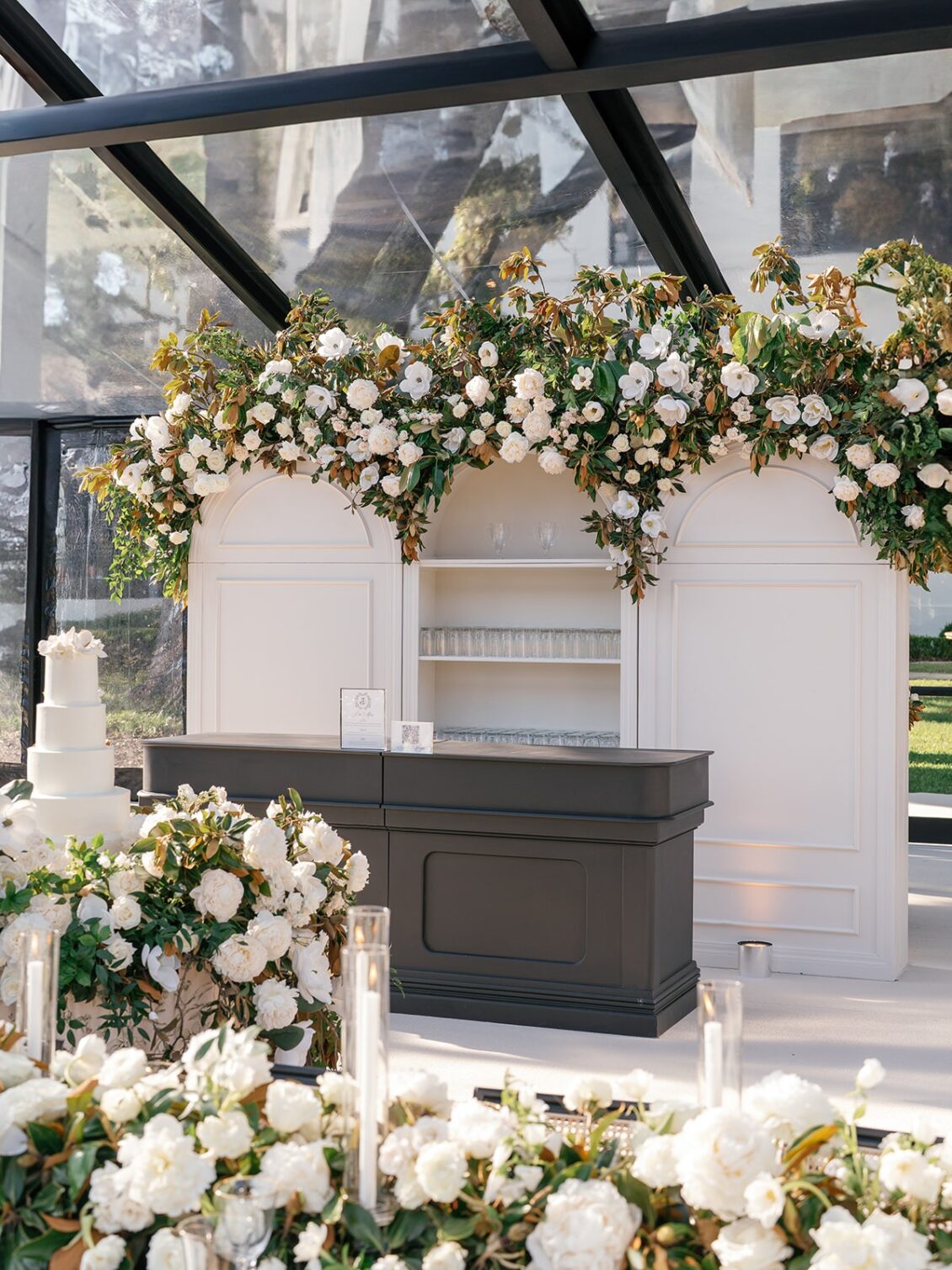 Magnolia florals, checkerboard details, and reception design at White House Biloxi.