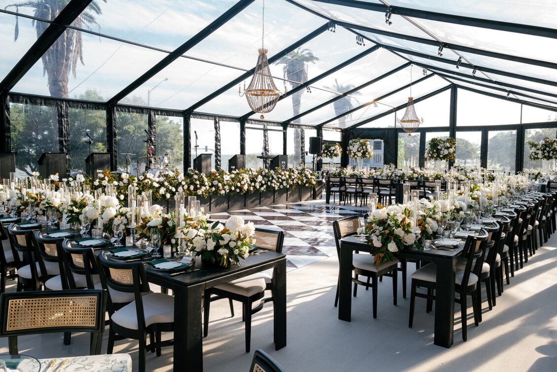 Magnolia florals, checkerboard details, and reception design at White House Biloxi.
