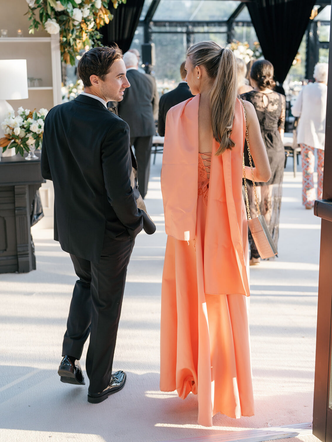 Guests crossing threshold into reception.