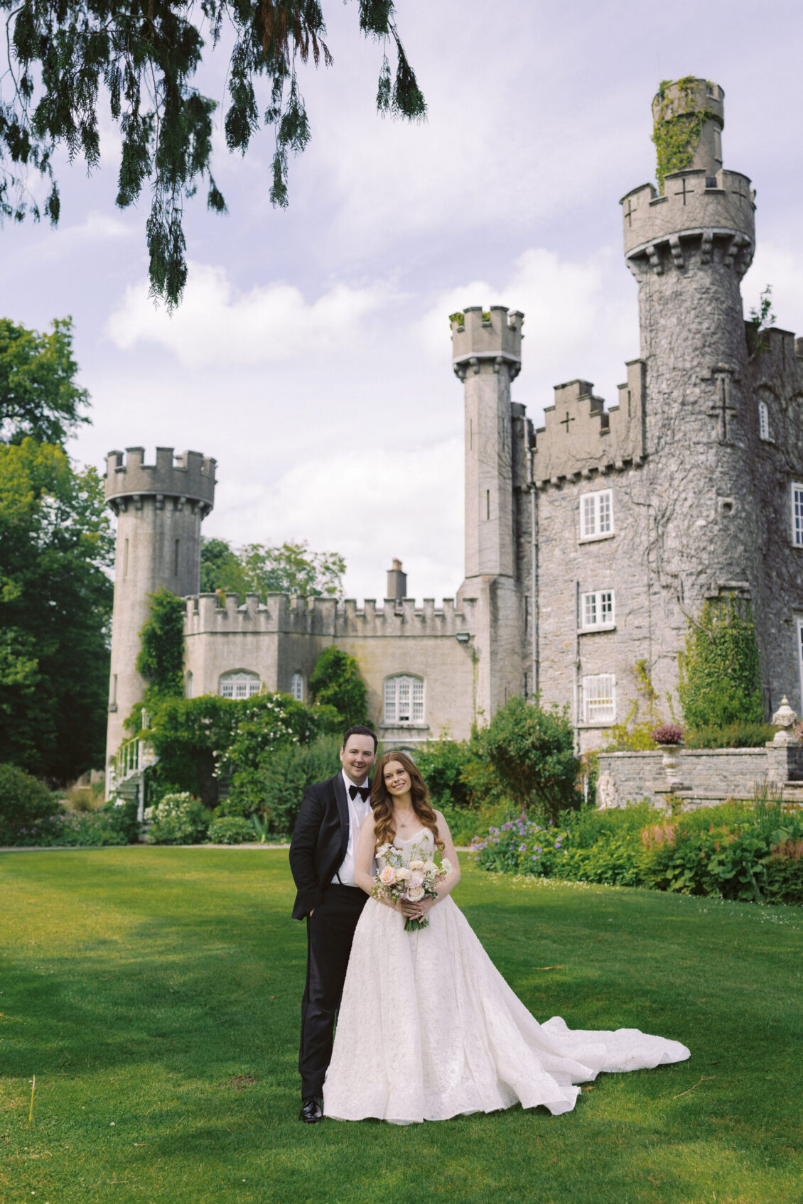 Newlyweds on the lawn at Luttrellstown Castle Resort