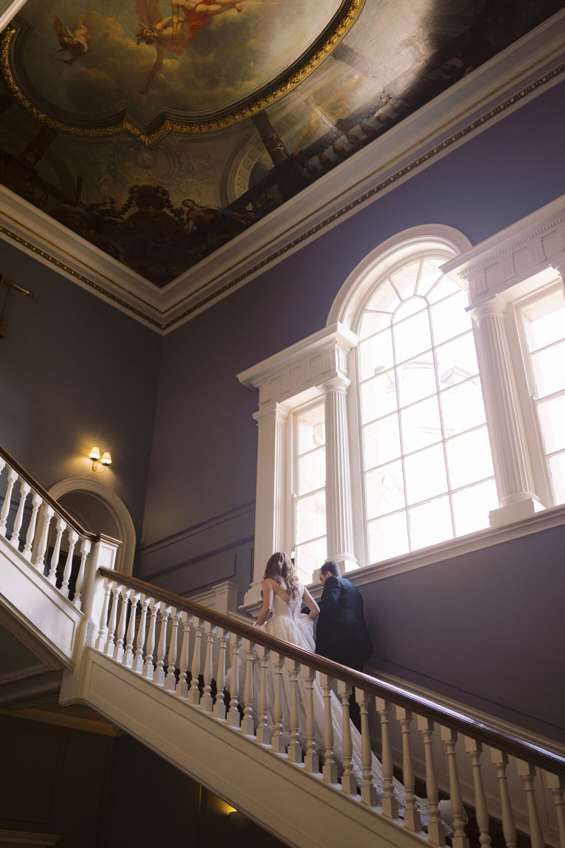 Arched window and painted ceiling above the staircase at Luttrellstown Castle Resort