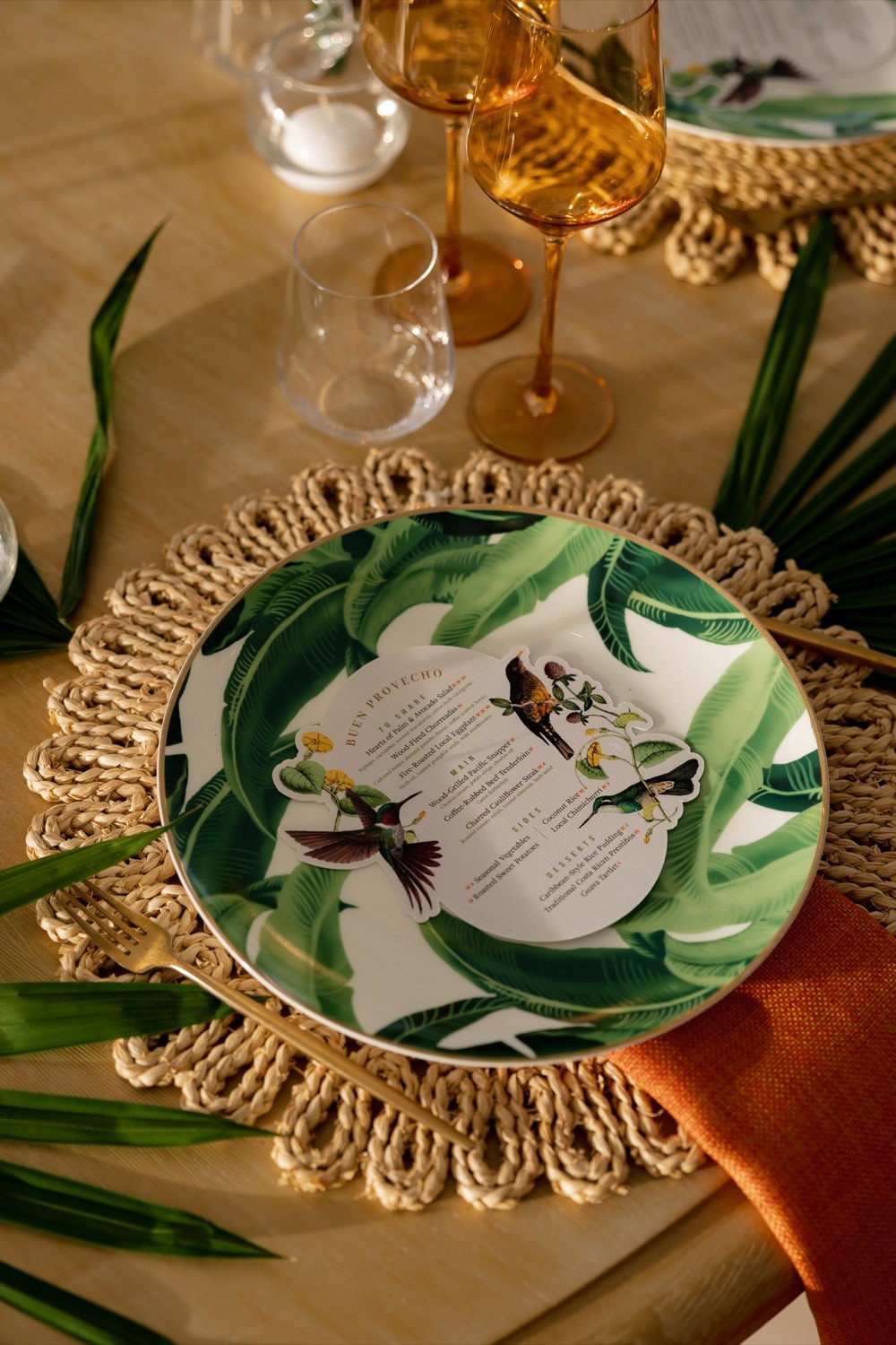 Botanical wedding place setting with menu and glassware at Nekajui