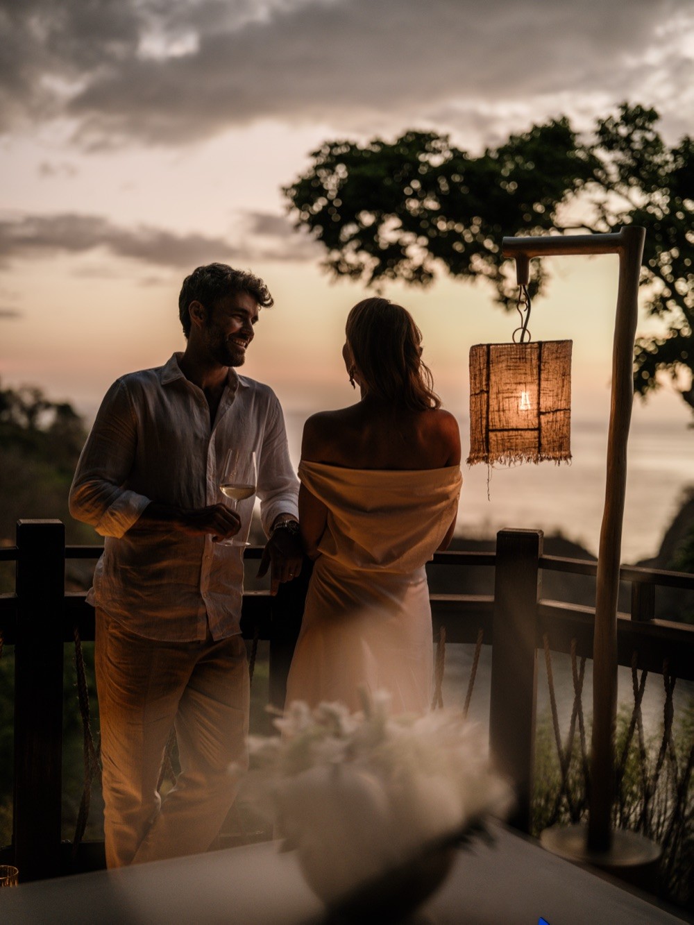 Couple on a sunset terrace at Nekajui in Costa Rica